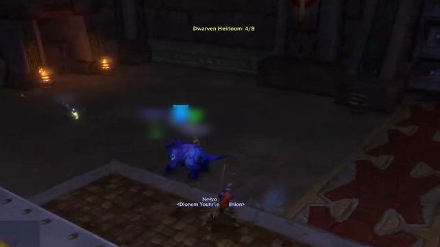 A dark dwarven hall with a stone tomb trimmed in gold in the foreground, candles along the far wall, and the on-screen text Dwarven Heirloom: 4/8