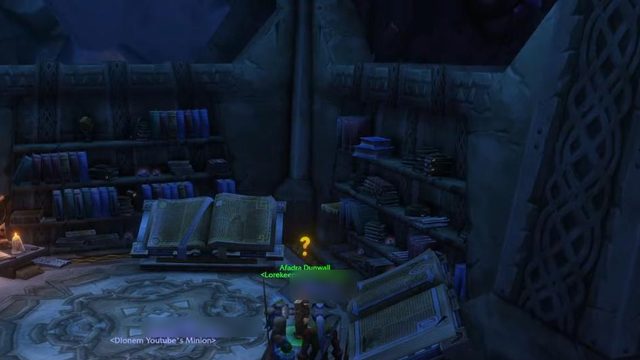 Ironforge's Hall of Explorers, with bookshelves, an open book on a lectern and a Lorekeeper standing on a rune-carved floor